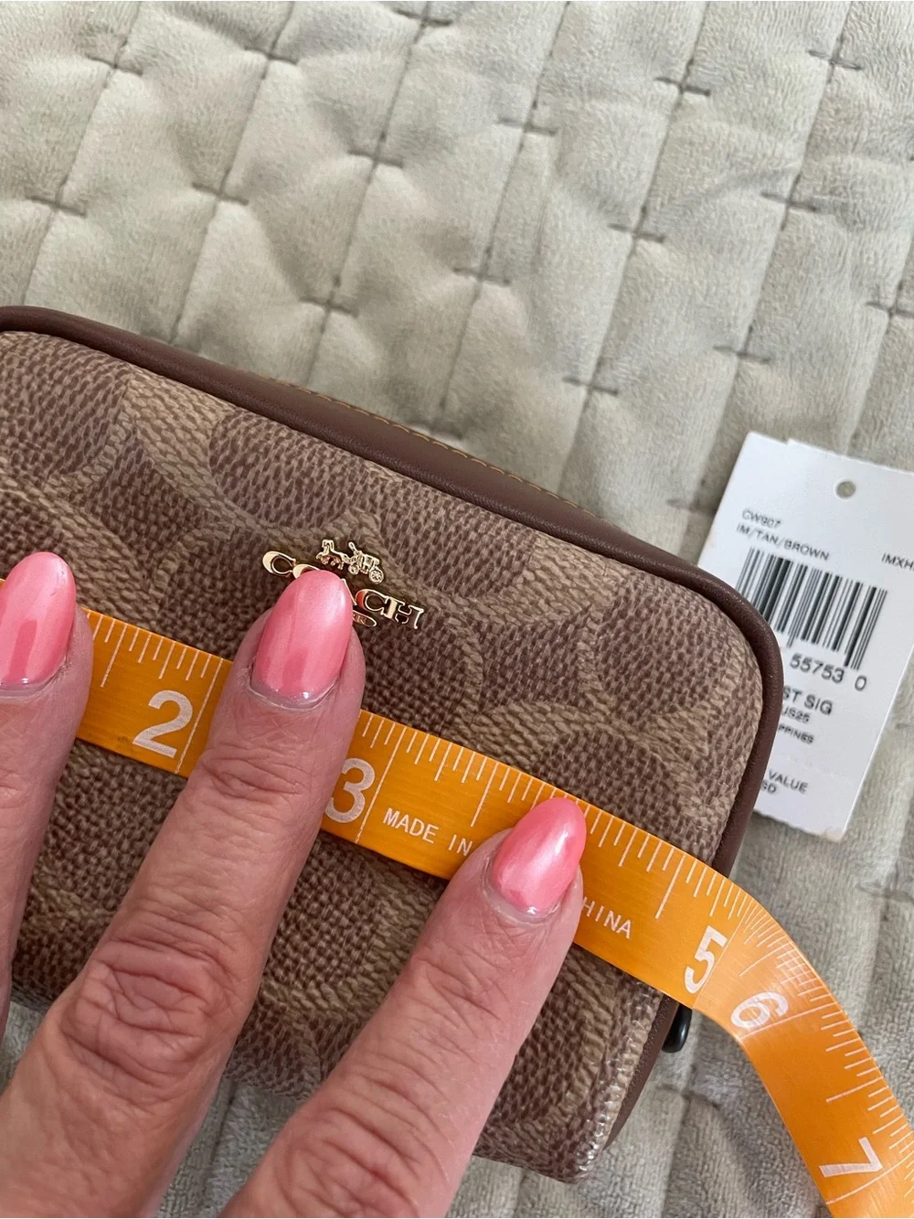 Coach Brown and Tan Interior Zip Pouch wristlet with Gold Hardware